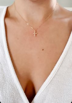 "Little Cross Necklace, tiny cross necklace, Dainty Minimalist Cross, 18K Gold Filled Chain, Gold Layering Necklace, cross necklace ♥This necklace features a delicate 14k gold filled chain, with a hint of shimmer.  Adorned with a gold & cz cross pendant.  Finished with a traditional gold filled spring clasp.   ♥The Cross is a dainty 12mm x 8mm  ♥LENGTH - The length shown is 16\". Please choose your desired chain length when checking out. ♥FINISH - Available in gold & silver. Please choose your d Small Gold Cross Necklace, Necklace Layers, Tiny Cross Necklace, Dainty Cross Necklace, Tiny Cross, Necklace Cross, Gold Cross Necklace, Mini Cross, Small Crosses