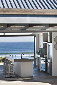 a kitchen with an ocean view is shown