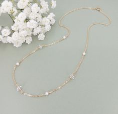 Introducing the Herkimer Diamond and Pearl Station Necklace, a stunning accessory that exudes elegance and charm. Available in 14k gold filled or sterling silver, this necklace features a delicate chain adorned with alternating Herkimer diamonds and tiny freshwater pearls. Herkimer diamonds are exquisite faceted natural crystals mined in Herkimer, NY. Available in 14k gold filled or sterling silver Features alternating Herkimer diamonds and tiny freshwater pearls on a delicate chain Herkimer dia Station Necklace, Delicate Chain, Herkimer Diamond, Natural Crystals, Anklets, Freshwater Pearls, Gold Filled, 14k Gold, Diamonds