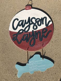 a wooden sign that says cayson layne on it