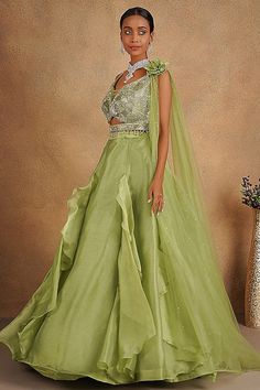 Description:- Featuring a green lehenga in organza base. It is paired with an ornate blouse having sequins, cutdana and stone embellishments, including a sequins embellished dupatta. Accentuate it with statement earrings and heels for a festive occasion or wedding ceremony. About: Color Pista Green Fabric Organza & Net Occasion Party Wear Style Evening dress Work Pearl, Sequins, Cut Dana, zarkan Chest 36 Length 45 Please note: Originally stitched in size 36 but can be altered for size 34 without Green Organza Lehenga, Blouse Lehenga, Indo Western Gown, Sequence Blouse, Saree Petticoat, Kurta Pajama Men, Pista Green, Organza Lehenga, Full Sleeve Blouse