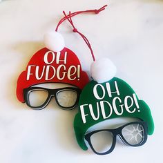 two christmas hats and sunglasses with the words oh fudge on them