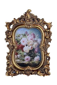 an ornate gold frame with flowers in it