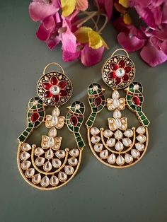 Discover a world of timeless beauty with our exquisite earrings collection. Each piece is a testament to the artistry and craftsmanship of our skilled artisans. Product Details: Material: Made of high-quality brass, copper, gold plating, Kundan work, stones. Dimensions: Weight per Pair:  42 grams Length:  7.5 cm Width:  4.5 cm Closure Type: Push Back Closure with Extra Support Clip at the Back.  Stand Out: Elevate your style with these unique, statement-making earrings that are bound to turn hea Traditional Wedding Earrings With Artistic Design, Traditional Wedding Jewelry With Artistic Design, Handmade Chandbali Jewelry For Formal Events, Handmade Chandbali Jewelry For Formal Occasions, Luxury Round Earrings For Ceremonial Occasions, Gold Jewelry With Artistic Design For Festivals, Elegant Metal Chandbalis With Meenakari, Elegant Metal Meenakari Chandbalis, Elegant Festive Jewelry With Artistic Design