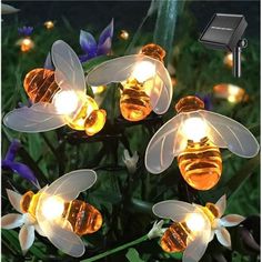 solar powered garden lights with bees on them