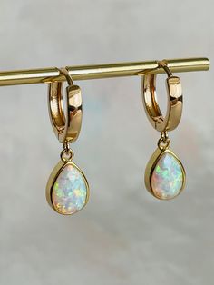 Add some sparkle to your ears with Opal Huggies. These beautiful earrings have such a stunning shine. With their versatile opal gemstone and color-matching abilities, they'll be the perfect complement to any outfit. Gemstone: Man-made Opal stone Material: Available in 18k Gold Plated & 18k Gold Filled Stone Material, Opal Stone, Opal Gemstone, Beautiful Earrings, Color Matching, Gold Filled, Opal, 18k Gold, Gold Plate