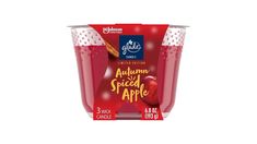 an apple juice in a plastic cup on a white background with the label for autumn spice apple