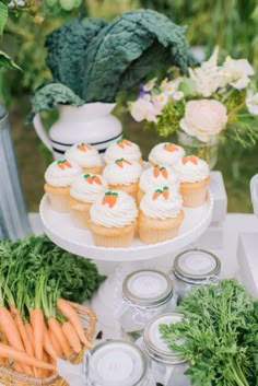 cupcakes and carrots are on a table