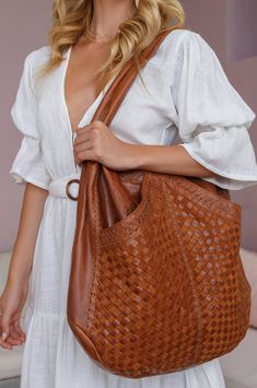 The eye-catching French Lover is a detailed luxury tote bag handcrafted from rich leather. All eyes will be on you when you step out with such a chic accessory detailed with rich intricate weaving and leather stitching on the sides. Featuring two front slip pockets it's large enough to fit your essentials on your romantic and chic weekend getaway. Style this tote with your favorite pair of jeans, maxi skirt, or mini dress. French Lover will also make a perfect stylish mum bag. Measurements: leng Spirit Walker, Elf Style, Slouchy Purse, Needlepoint Accessories, Women Boho Style, Bohemian Handbags, Luxury Tote Bag, Luxury Tote Bags, Western Handbags