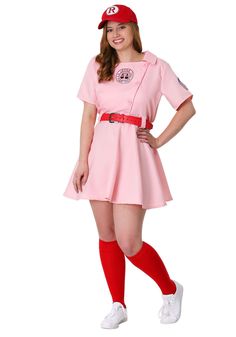 a woman in a pink dress and red socks is posing for the camera with her hands on her hips