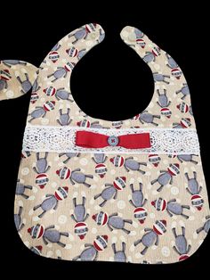 This handmade one-of-a-kind 3 piece baby set includes rectangle bib, hair band, and clip on binky/toy holder. It is made of a vintage fine cotton print in a sweet sock monkey design backed with soft flannel. It has lace & button accents. NB-6M Binky Holder, Monkey Print, Monkey Design, Baby Sewing Patterns, Lace Button, Sock Monkey, Baby Set, Baby Sewing, Cotton Socks