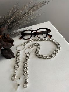 "Oversized O ring light grey glasses chain, sunglasses bold chain holder, aluminum statement chain layered necklace, chunky curb chain holder Welcome to my shop! ✈️ DHL EXPRESS SHIPPING AVAILABLE, 1-3 BUSINESS DAYS DELIVERY! ✔️ PLEASE MAKE SURE TO SELECT IT, RIGHT BEFORE YOUR PURCHASE! ❗️ ❗️ DON'T FORGET TO ADD YOUR CELL # AT THE \"NOTE TO SELLER\" SECTION IF YOU CHOOSE DHL! BY FILLING YOUR CELL NUMBER YOU EARN THE BENEFIT TO CHOOSE BETWEEN 6 DIFFERENT DELIVERY OPTIONS! INSTRUCTIONS WILL BE SENT Trendy Metal Glasses Chains With Chain Strap, Modern Silver Glasses Chains As Gift, Modern Silver Glasses Chains For Gift, Metal Glasses Chains As Gift, Modern Metal Glasses Chains With Adjustable Chain, Adjustable Silver Glasses Chains, Modern Adjustable Silver Glasses Chains, Silver Glasses Chains For Fashion Accessory, Adjustable Silver Metal Glasses Chains