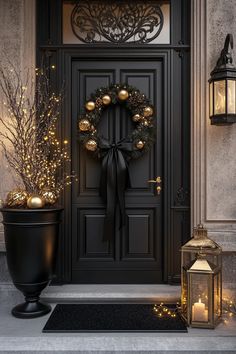 Elegant entryway with black gold and silver Christmas decor wreath lantern and black and gold Christmas party decor Black And Gold Christmas Aesthetic, Black Silver And Gold Christmas Decor, New Years Porch Decor, New Years Front Porch Decor, New Years Eve Wreath, Christmas Decor Ideas Nutcracker, White Black And Gold Christmas Tree, New Years Decor Ideas, Luxury Christmas Decor Ideas