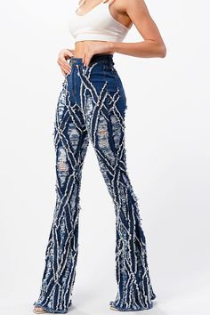 High-rise, bell bottom jeans with extreme distressing and fraying design. Traditional 5-pocket construction with a zip fly and button closure. Slim fit silhouette with a comfortable stretch. This style is truly one of a kind. However as with any distressed jeans, some minor flaws may be present such as torn fringe tassels or cuts and uneven colors. Each item is inspected for quality. CARE | Hand Wash or Machine Wash Gentle in a Wash Bag CONTENTS | 97% Cotton, 3% Spandex MEASUREMENTS | 45"/114 cm Sparkle Jeans, Bag Contents, Torn Jeans, High Rise Denim Jeans, Fashion Book, Bottom Jeans, High Waisted Flares, Flare Leg Jeans, Bell Bottom Pants