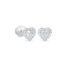 Feminine and romantic, these earrings feature two perfectly matching heart-shaped diamonds, ethically sourced and hand-selected for maximum brilliance. The hero diamonds are framed by shimmering halos of micropavé, for a total of ~0.60 carats. Unique yet understated, these earrings wear beautifully alongside other styles from the collection. De Beers Jewelry, Heart Shaped Diamond Earrings, Diamond Heart Earrings, Beautiful Wardrobe, Expensive Jewelry Luxury, Diamond Jewelry Designs, Heart Shaped Diamond, Jewelry Luxury, Expensive Jewelry