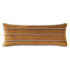 a brown and white striped pillow on a white background