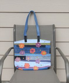 a blue and white bag sitting on top of a chair