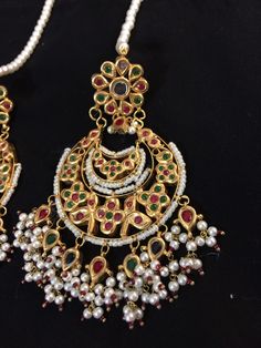 chandbali made using kundan and 22 carat gold plated ear supports included Multicolor Chandbalis With Intricate Temple Design, Multicolor Chandbali Earrings With Intricate Design, Kundan Chandbali Earrings In Temple Jewelry Style, Kundan Chandbali Jewelry With Tassels, Multicolor Chandbali Bridal Earrings With Intricate Design, Kundan Chandbali Jewelry With Latkans, Kundan Chandbali Temple Jewelry Earrings, Multicolor Intricate Chandbali Bridal Earrings, Multicolor Kundan Chandbalis With Intricate Design