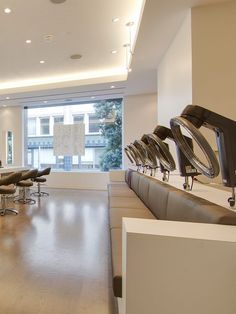 an empty room with chairs and desks in it