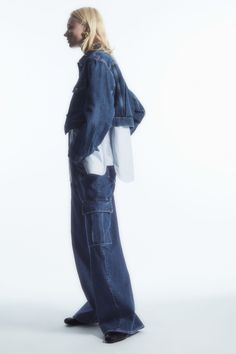 Embrace the utility trend with these denim cargo trousers from our new collection. Crafted from a blend of organic recycled and organic, they're shaped with wide, full-length legs, neatly press creased and detailed with the signature oversized flapped pockets. Tap into '90s minimalism by styling them with a white tank and a pair of thong sandals.  Relaxed fit5-pocket style, shank button closureRecycled cotton is made by converting both pre- and post-consumer fabric into fibres that are then spun Denim Advertising, Denim Studio, Denim Editorial, Fashion Editorial Layout, Double Denim Looks, Denim Cargo Pants, Denim Wear, Double Denim, Cropped Denim Jacket