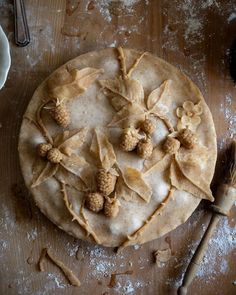 an uncooked pie sitting on top of a wooden table