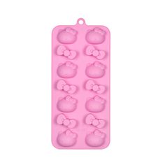 an ice tray with hello kitty design on the front and back of it, in pink