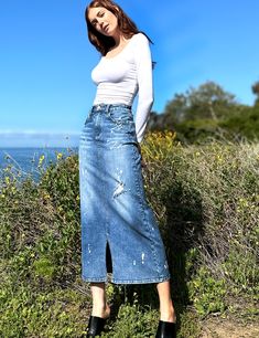 This is our Beloved Relaxed Maxi Skirt — gorgeous wash and distressed detail, in our ultra-premium denim, with pieced construction. We love it! The model is 5'9" wearing a size 26 Fabric: 98% Cotton 2% Spandex Length: 35" from waistband Fitted Full-length Denim Skirt With Frayed Hem, Full Length Medium Wash Denim Skirt With Frayed Hem, Chic Distressed Cutoff Denim Skirt, Ripped Denim Skirt In Medium Wash, Ripped Medium Wash Denim Skirt, Distressed Denim Skirt In Medium Wash, Fitted Denim Skirt With Distressed Details, Distressed Cutoff Denim Skirt For Fall, Fall Distressed Cutoff Denim Skirt