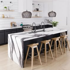 a kitchen with black and white marble counter tops