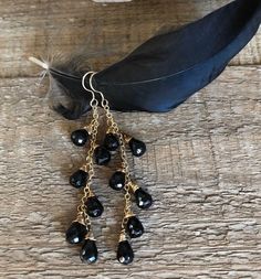 Gold filled dangle earrings wire wrapped with black onyx gemstones Elegant Onyx Wire Wrapped Jewelry, Nickel-free Black Beaded Dangle Earrings, Nickel-free Black Beaded Drop Earrings, Black Dangle Linear Earrings, Handmade Black Long Drop Earrings, Nickel-free Black Long Drop Jewelry, Elegant Black Chandelier Earrings With Dangling Beads, Elegant Black Long Drop Chandelier Earrings, Nickel Free Black Long Drop Earrings