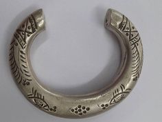 "VINTAGE ANTIQUE BEAUTIFUL TRIBAL OLD SILVER CUFF BRACELET OR BANGLE FROM RAJASTHAN INDIA, WORN BY TRIBAL PEOPLE OF RAJASEHAN. NICE FISH DESIGN BRACELET WITH VERY NICE HANDMADE ENGRAVING ON IT, GOOD FOR YOUR JEWELLERY COLLECTION. Inner Diameter side to side - 6.4 cm(2.5\") Inner circumference without open part - 13.5 cm(5.3\") open part - 4.2 cm(1.65\") Outer Diameter side to side - 9.3 cm(3.66\") Width - 1.5 cm(0.59\") Weight - 71 grams Material - Silver & original old worn piece." Traditional Silver Stamped Bangle, Traditional Stamped Bangle Bracelet, Traditional Stamped Bangle Jewelry, Traditional Stamped Ceremonial Bangle, Traditional Ceremonial Stamped Bangle, Traditional Stamped Bangle For Wedding, Design Bracelet, Rajasthan India, Silver Bangle Bracelets