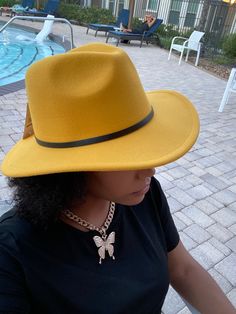 Accessorize any outfit with our most loved fashion fedora. Make heads turn in these. Yellow Casual Fedora With Flat Brim, Yellow Flat Brim Fedora Casual Style, Casual Yellow Fedora With Flat Brim, Gold Fedora Hat For Winter, Casual Yellow Fedora With Short Brim, Yellow Fedora Hat For Fall, Chic Gold Fedora For Summer, Trendy Gold Fedora Hat, Gold Fedora With Short Brim