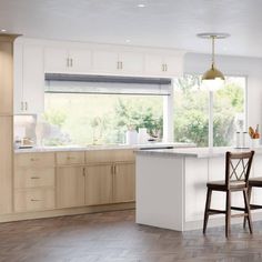 a kitchen with an island and chairs in the center, along with white walls and wood flooring