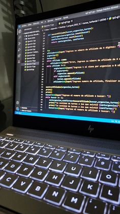 an open laptop computer sitting on top of a desk