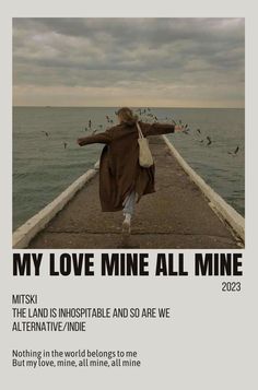 a woman walking down a pier next to the ocean with birds flying over her and text that reads, my love mine all mine