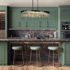 a kitchen with green cabinets and marble counter tops, two stools at the bar