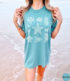 Discover our Sea Animals Comfort Colors summer beach vacation shirt! This trendy Beach t-shirt features an eye-catching Mandala graphic design that is sure to enhance your next beach vacation! Made of 100% ring-spun ethically grown cotton, this shirt is super soft and comfortable. It has a relaxed fit which is made of a medium fabric that is preshrunk. Looks super cute with shorts, jeans or as an oversized beach cover up. Great gift for a Beach Lover! Comes in 13 pretty colors! ♦️Please message Blue Beachwear T-shirt For Beach Party, Beach Graphic Tee T-shirt With Print, Blue Short Sleeve T-shirt For Beach Season, Beach Season Printed Short Sleeve Tops, Beachy Shirt For Beach Party, Beachwear Printed Short Sleeve Tops, Blue Short Sleeve Tops For Beach Season, Printed Short Sleeve Beachwear Tops, Printed Short Sleeve Tops For Beach Season