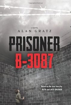 a man standing in front of a wall with barbed wire on it and the words prisoners 8