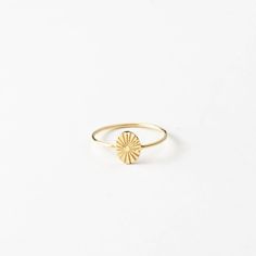 "Here comes the sun! Add this small sunbeam ring to your stack for a daily dose of sunshine.  Every piece is handcrafted and hand-personalized with love in La Conner, WA, using 90% recycled and 100% ethically sourced raw materials from the USA--because it's better that way. Includes free gift-ready packaging (featuring a care card and traditional letterpress goodies made by my dad)!  MATERIALS: * Gold = 14k gold filled * Silver = sterling silver DETAILS: * 8x6mm oval * Hand-personalized with traditional metal punches AT CHECKOUT: * If you chose \"other\" for size, specify which ring size you'd like in a note. * Select expedited shipping (and add a note with your ideal delivery date) if you need your piece sooner than our standard production time. GIFT NOTES: * At checkout, check the box if Starburst Ring, Sunburst Ring, Sun Design, Oval Ring, Oval Rings, Personalized Rings, Classic Ring, Jewelry Inspo, Ring Finger