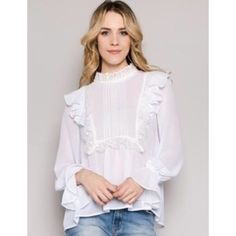 This Romantic Blouse Is The Perfect Choice For Adding A Little Elegance To Your Outfits! Featuring A Soft Fabric Paired With Gorgeous Ruffles And Delicate Lace Accents, Pleated Details, And High Low Hem, It's Simply Darling! Color: White / Ivory Material: 100% Polyester Hand Washes Cold. Measurements: Size S: Bust Armpit To Armpit 19”. Length (High -Low) 23” To 25” Size M: Bust Armpit To Armpit 20”. Length (High -Low) 24” To 26” Size L: Bust Armpit To Armpit 22”. Length (High -Low) 25” To 27”. Romantic Blouses, Blouse Lace, White Lace Blouse, High Low Top, Embellished Blouse, Ruffle Long Sleeve, Embellished Top, Boutique Tops, Lace Ruffle