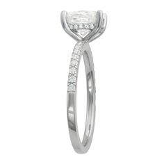 a white gold engagement ring with an oval cut diamond and pave set diamonds on the side