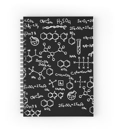 a spiral notebook with black and white chemical symbols