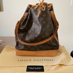 Vintage Louis Vuitton Noe Bag. This Is Vintage Bag From 1995 And Does Not Have The Tag Inside The Bag. However It Does Have Proof Of Authenticity With The Card From What Goes Around Comes Around. There Are Some Water Stains On The Bottom Of The Bag And Around The Top Edge. Nothing Super Noticeable Unless You Really Look For It. Otherwise In Great Condition. The Shoulder Strap Is Perfect. Stored In The Cloth Bag (And I Have Never Used It). Date Code Ar0925 - Last Picture. (I Had To Watch A Video Designer Brown Shoulder Bag In Signature Coated Canvas, Designer Bucket Bag For Travel, Designer Travel Bucket Bag, Pre-owned Brown Shoulder Bag, Designer Everyday Shoulder Bag In Signature Coated Canvas, Designer Shoulder Bag In Signature Coated Canvas For Everyday, Designer Monogram Canvas Bucket Satchel Bag, Pre-owned Brown Leather Shoulder Bag For Daily Use, Luxury Coated Canvas Bucket Bag For Formal Occasions