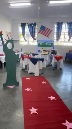 an american themed party with red, white and blue table cloths on the floor