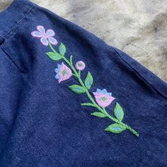 "60s 70s era true vintage dark blue denim shorts with embroidered floral details 🍒🌼 such a perfect pair of shorts we've had this in are archives for a minute and they need to be adored by someone special 🌼🍒 waist 29\" hips 38\" rise 12\" length 13\"" Denim Blue Cotton Bottoms With Floral Embroidery, Denim Blue Floral Embroidered Cotton Bottoms, Vintage Floral Embroidered Bottoms For Summer, Floral Embroidery Short Length Cotton Jeans, Floral Embroidered Cotton Short Jeans, Embroidered Dark Wash Cotton Bottoms, Embroidered Dark Wash Bottoms For Summer, Embroidered Cotton Jean Shorts, Embroidered Cotton Short Jeans