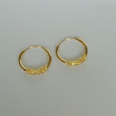 IMPORTANT **Please go through all the pictures i have posted for a listing with a ruler, on a model, on my hand, to get an exact idea of the actual size of the item. Bali style sterling silver ear hoops dipped in real gold. Dimensions: 1.2 x 14 mm Price listed is for a pair of ear hoops. These earrings are made of 925 hypoallergenic sterling silver. All my pieces are sent in a gift box. I can include a personal message from you if needed. You are welcome to contact me at... bhavnakwintra1956@gma Dainty Gold Small Hoop Cartilage Earrings, Gold Small Hoop Nose Rings For Everyday, Dainty Gold Hoop Cartilage Earrings, Gold Plated Small Hoop Cartilage Earrings, Gold Hypoallergenic Small Hoop Nose Rings, Hypoallergenic Small Hoop Gold Nose Rings, Gold Adjustable Small Hoop Nose Ring, Traditional Small Hoop Gold Plated Earrings, Gold Brass Temple Jewelry Hoop Earrings