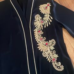 Women Abaya Worn Once Very Good Condition Beautiful Color And Material Size Large Elegant Embroidered Abaya For Festive Occasions, Traditional Black V-neck Abaya, Elegant V-neck Formal Abaya, Festive Evening V-neck Abaya, Luxury Long Sleeve Evening Abaya, Black V-neck Abaya For Eid, Elegant V-neck Festive Abaya, Formal V-neck Elegant Abaya, Traditional Long Sleeve Abaya For Evening