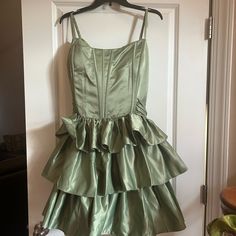 Stacees Green Dress Never Worn With The Tags Still On. Was Planning To Wear For Homecoming But It Was To Big. The Size Is 26 And The Measurements Are On The Tag In The Photo Above. Was Originally Bought For 152 Dollars But Will Sell For 90 Dollars. Let Me Know If You Have Any Questions Fitted Lined Tiered Dresses, Green Fitted Tiered Mini Dress, Fitted Green Tiered Mini Dress, Formal Green Mini Dress With Ruffles, Spring Formal Tiered Mini Dress, Green Tiered Mini Dress For Party, Vintage Satin Summer Dresses, Formal Tiered Dress With Fitted Bodice, Fitted Tiered Cocktail Dress