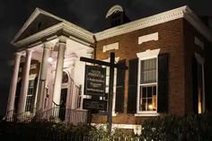 an old brick building lit up at night