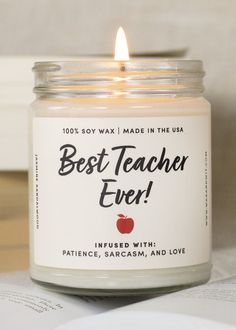 a candle with the words best teacher ever on it