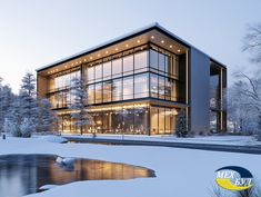 a large building with lots of windows and lights on it's side in the snow